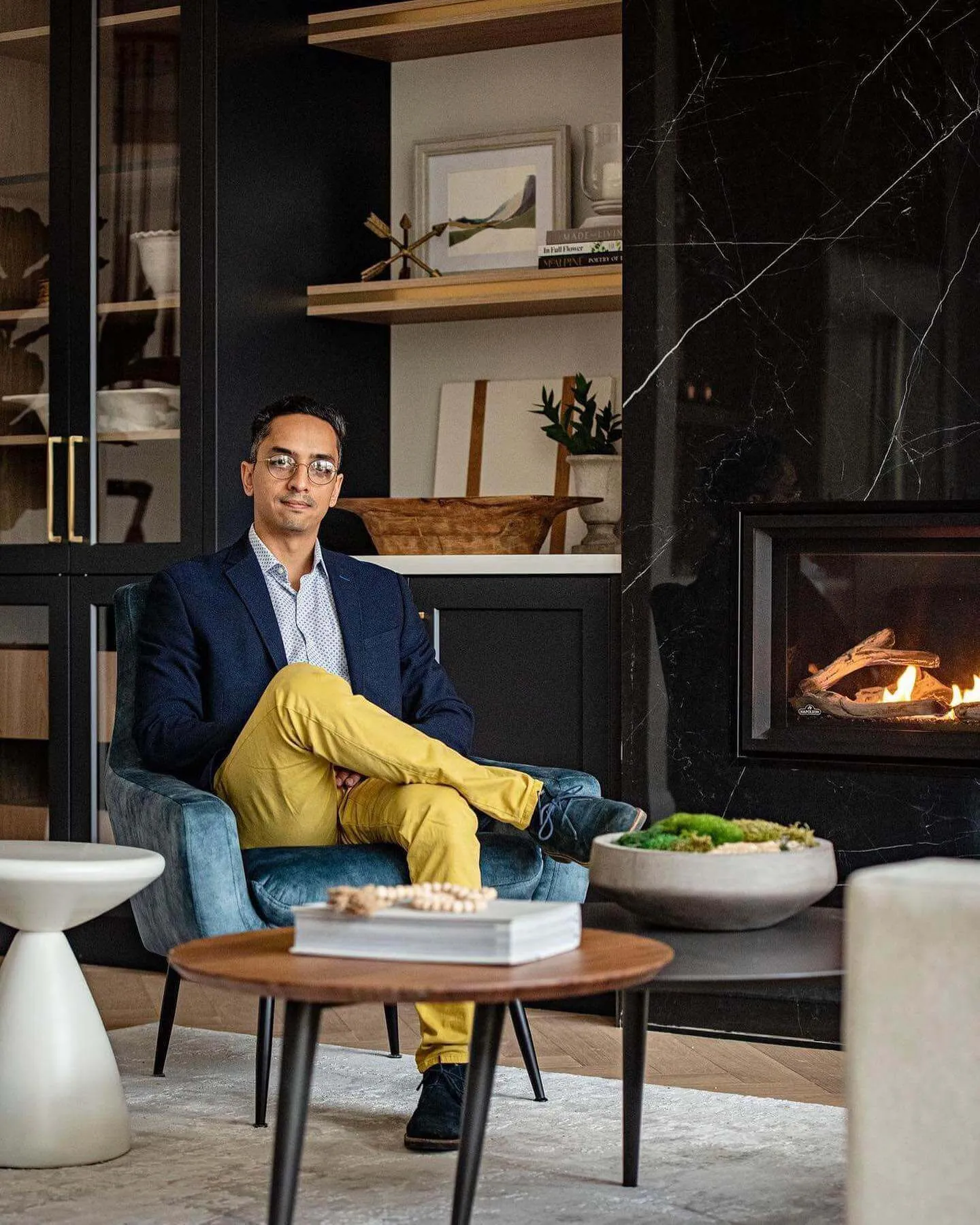 Adam Patel, Founder of Dovetail Developments, seated in a finished interior